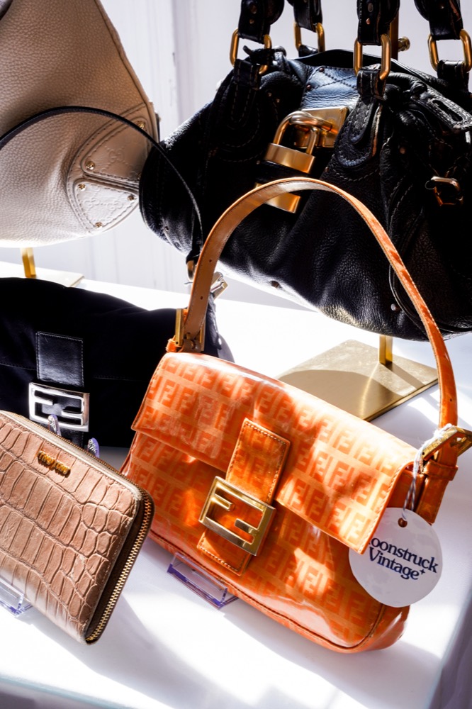 An orange vintage baguette bag on a table